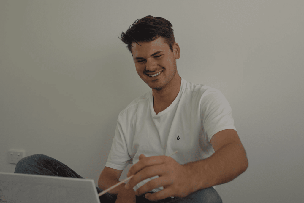 Man painting and smiling